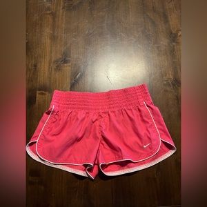 Pink Nike shorts.